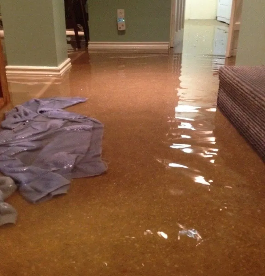Flooded room with wet floor and towel.
